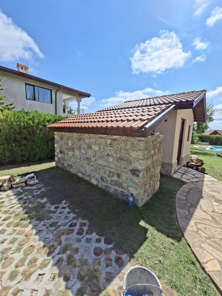 Finished decorative tiled roof over a stone wall at BlackSeaRama, Kavarna