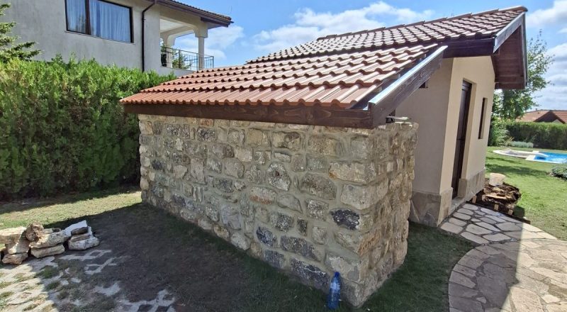 Finished decorative tiled roof over a stone wall at BlackSeaRama, Kavarna